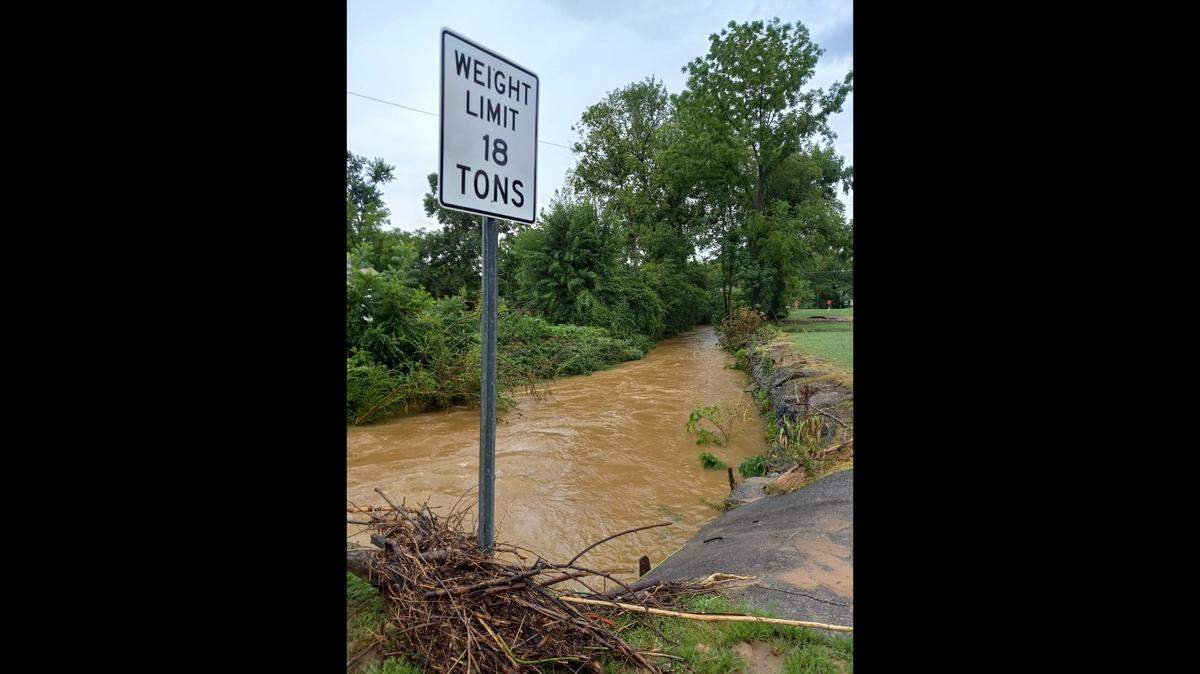 A bridge washed out in the Mayfield area due to historic flooding.