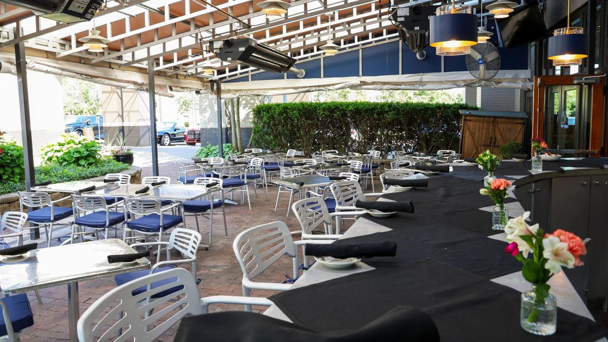 The outside bar and patio dining area at Azur Restaurant and Patio, shown Monday, May 20, 2025 in Lexington, Ky., has the same familiar look after the popular dining spot closed at the end of 2024 because there were unable to negotiate a new lease. But they, along with its popular patio dining space, will reopen officially on May 23 after a five-month absence.