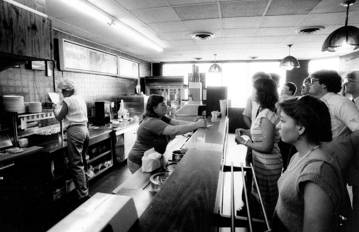 Ellen Johnson, center, took orders at the counter of Lexington’s Tolly-Ho restaurant, on the last day at its original spot, March 11, 1985. The popular campus hangout near the University of Kentucky has been a Lexington institution since 1971, when it opened at what was then 108 West Euclid Ave., today known as Winslow Street. In March 1985, the 24-hour greasy spoon couldn’t make a deal for a new lease and moved in August 1987 around the corner at 395 South Limestone. The owners rented there until May 2011, when they opened at their current spot, buying the empty Hart’s Dry Cleaning building at 606 South Broadway. At the original restaurant shown here, they sold two eggs, toast and jelly for 99 cents. But a quarter-pound hamburger, known as a Tolly, outsold everything else on the menu by a ratio of 10 to 1.