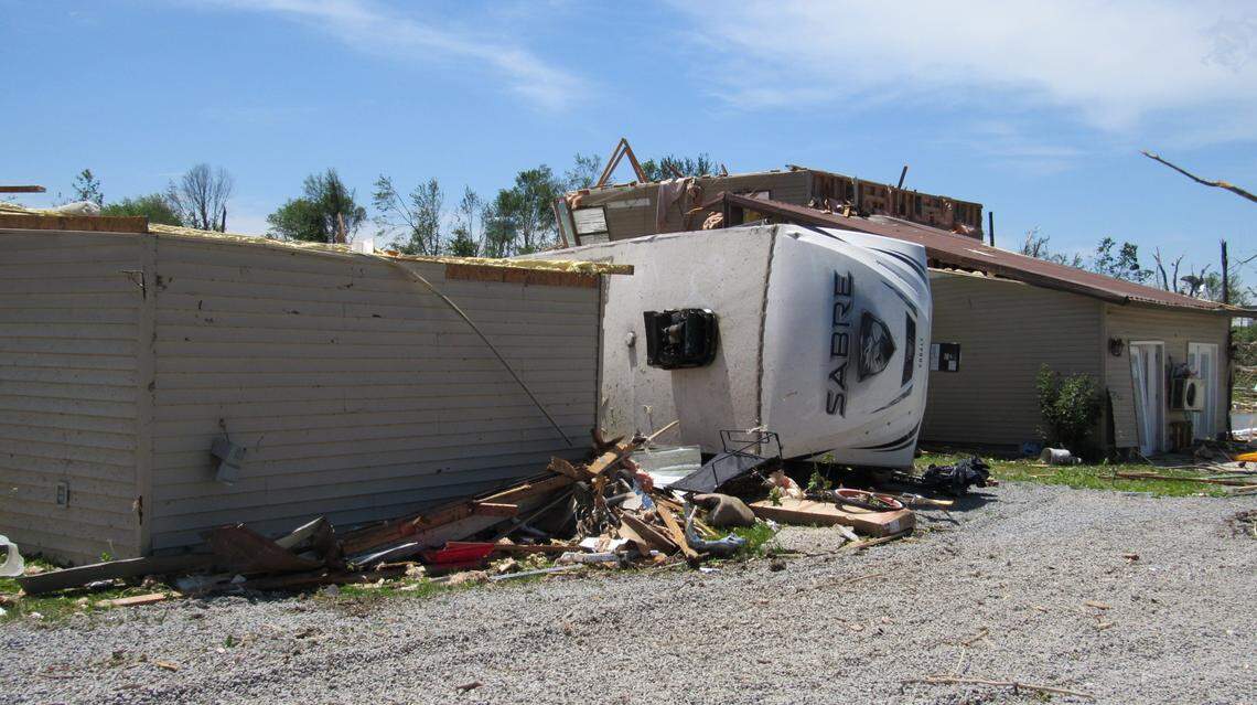A fifth-wheel camper was flipped on its side after a presumed tornado moved through southern London early Saturday, May 17, 2025.