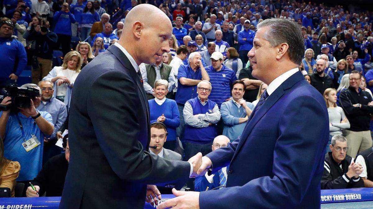 Louisville Cardinals head coach Chris Mack greets Kentucky Wildcats head coach John Calipari before their game at Rupp Arena in Lexington, Ky., Saturday, Dec. 28, 2019. Kentucky beat Louisville 78-70 in overtime.
