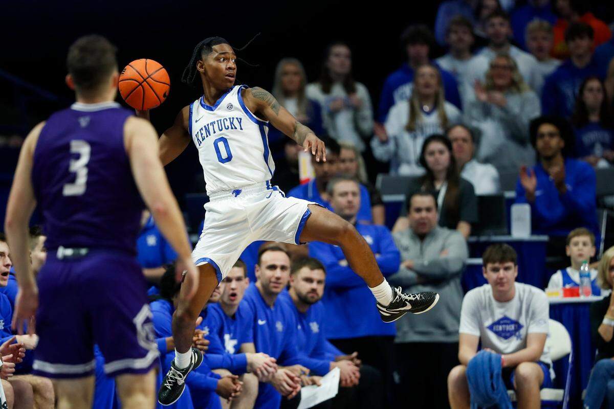 Kentucky guard Rob Dillingham (0) saves a ball from going out of bounds against Stonehill during Friday’s game at Rupp Arena.