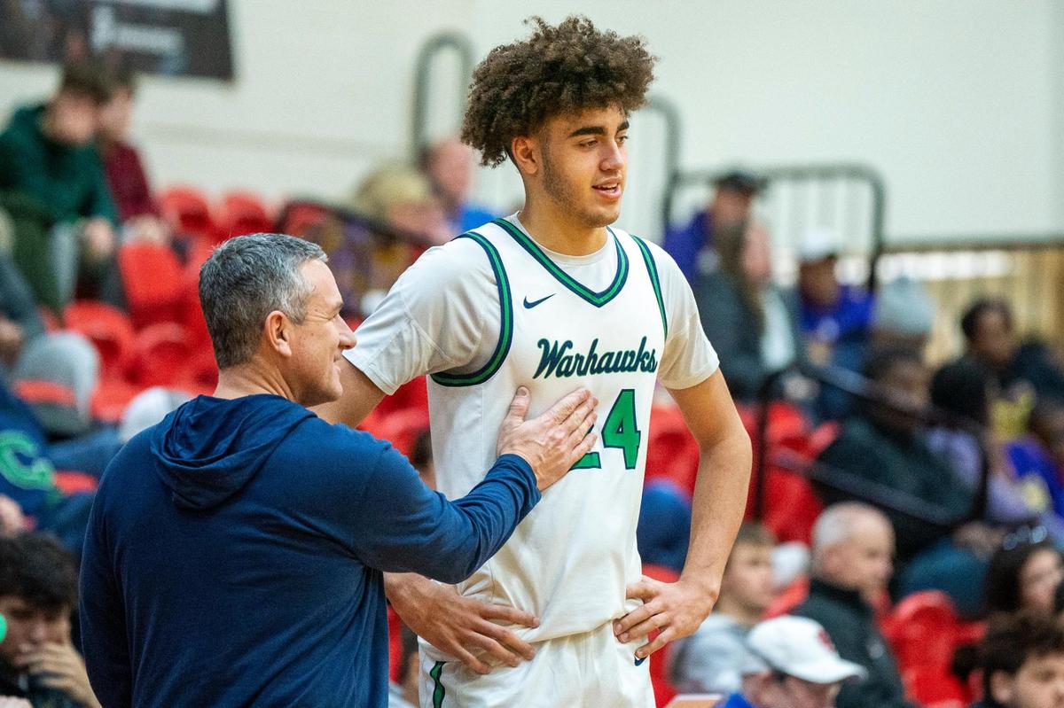 Great Crossing head coach Steve Page talks with Malachi Moreno (24) at the end of the Warhawks’ 65-63 win over Male at Scott County High School in the Dan Cummins Classic on Jan. 20.