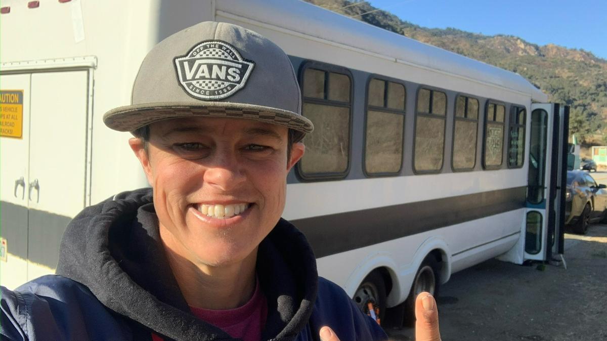 Lindsay Gardner is pictured with her 1993 Ford E-350 passenger shuttle bus that she hopes to use as a living space while working as the hitting development coordinator for the Kentucky Wild Health Genomes this summer in Lexington. Gardner is the first female coach in Atlantic League of Professional Baseball history.