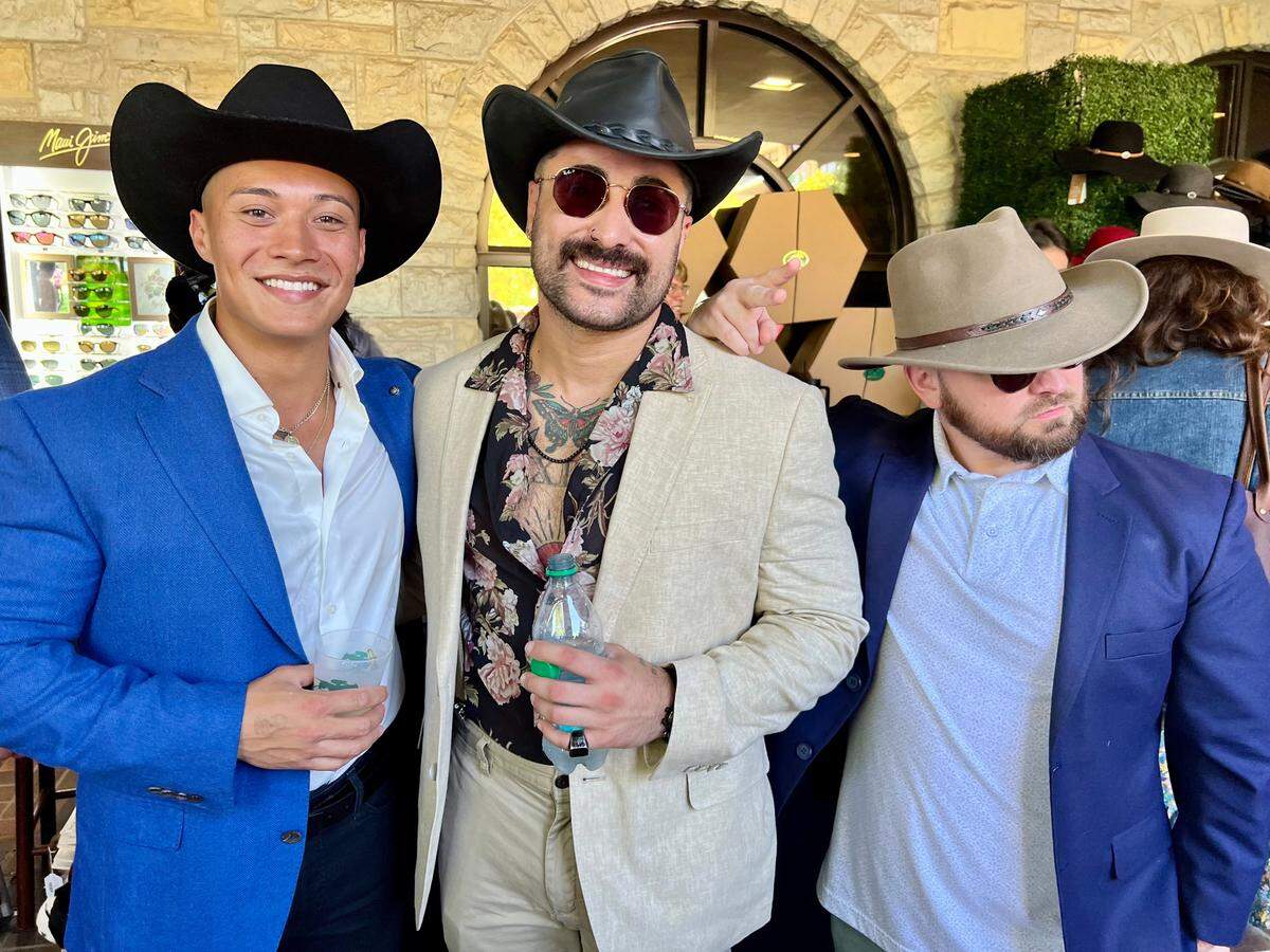 Friends pose for a photo while attending the 2024 Fall Meet opening weekend at Keeneland Race Course on Oct. 5, 2024, in Lexington, Ky. (Photo by James Crisp)