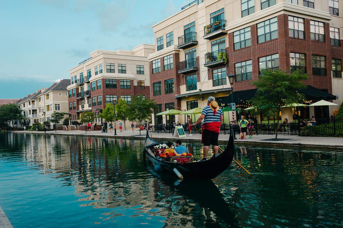 A gondolier takes passengers on a cruise of the three-mile downtown canal loop.