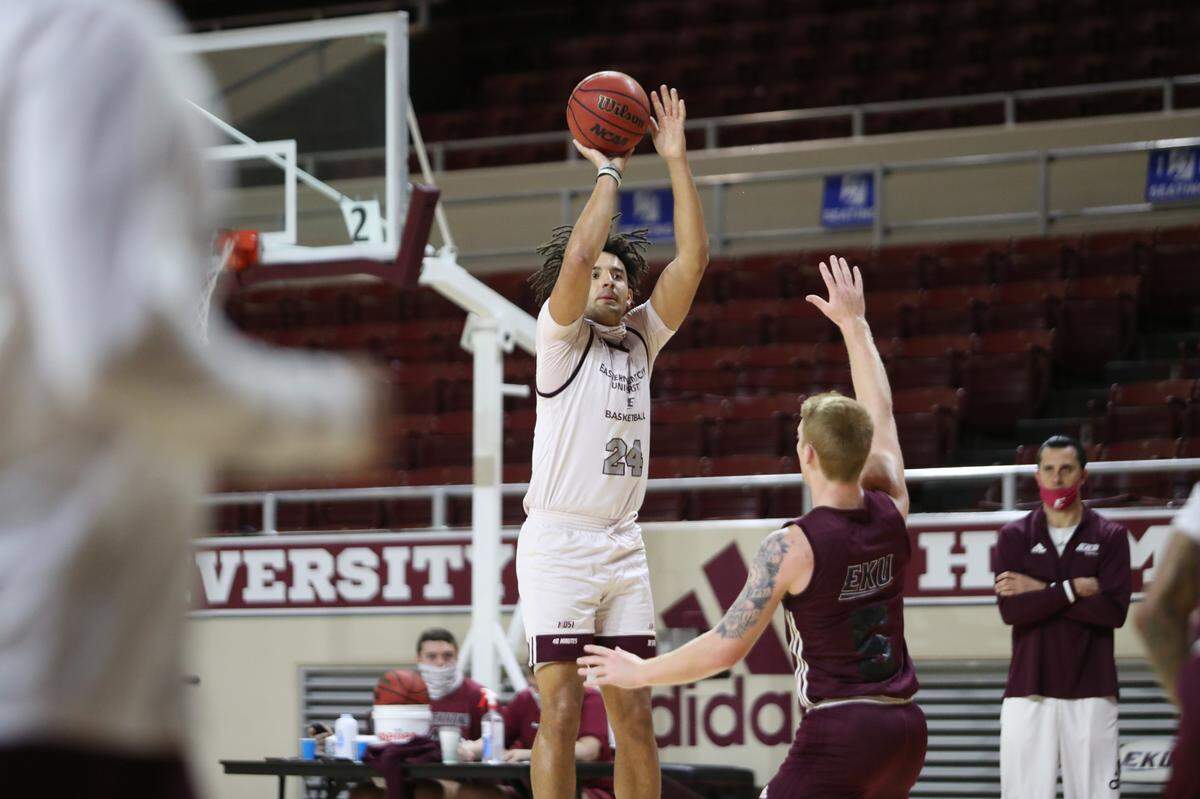 EKU forward Michael Moreno shot over Colonels guard Cooper Robb during practice leading up to the start of the 2020-21 season.
