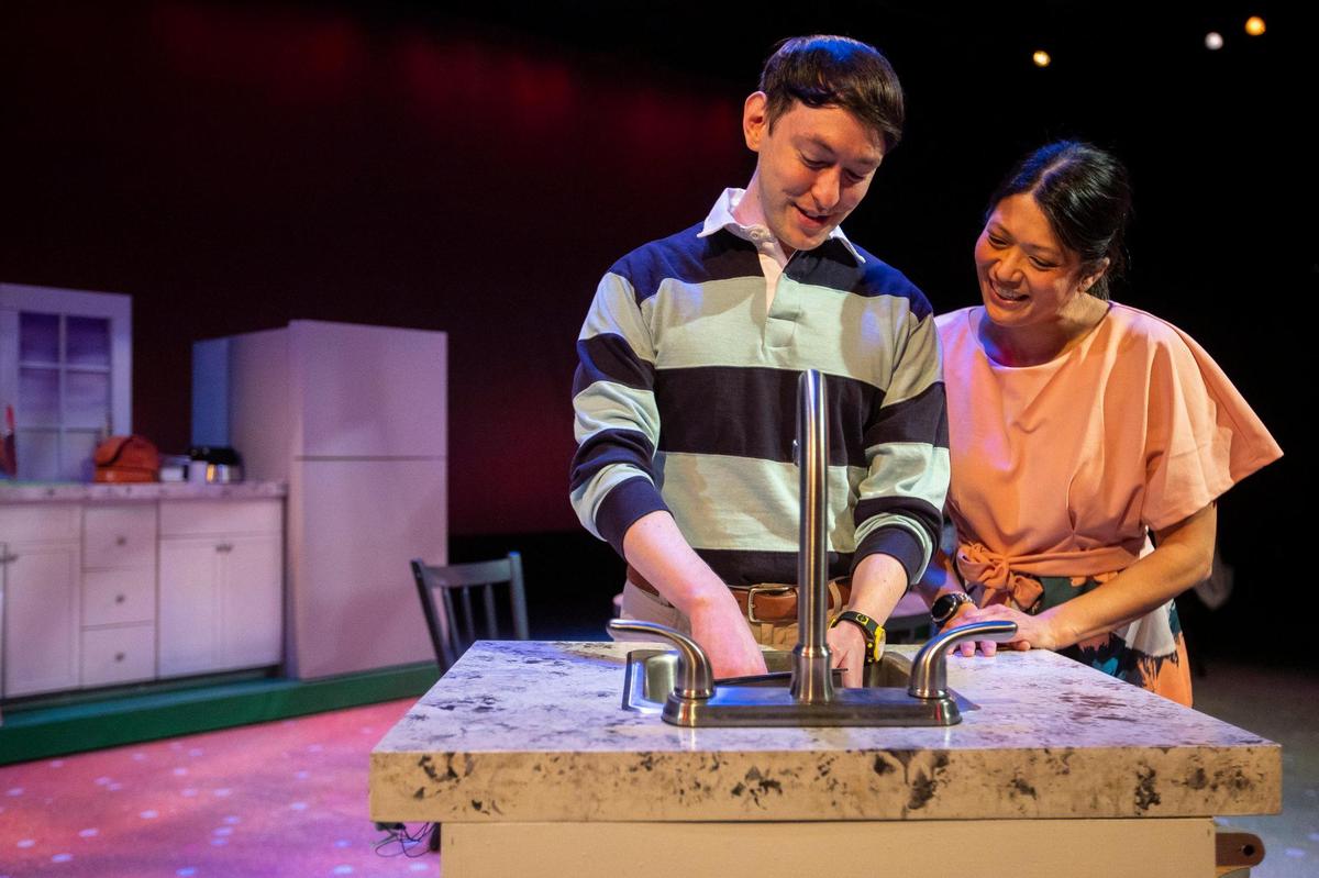 Rusty Allen, left, playing Lucas, and Kim Dixon, playing Emily, rehearse for “Shoyu Tell” which has its world premiere this weekend at the Lexington Children’s Theatre. The story is about a Japanese-American student whose lunchbox contents makes him the target of the school bully.