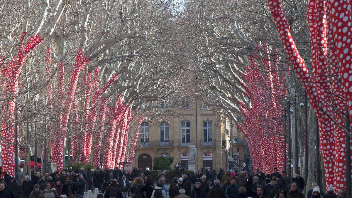 The town of Aix-en-Provence in southern France is split in two by the wide expanse of the Cours Mirabeau, above, which is flanked by umbrella-shaped plane trees, decorated here for the holidays.   
