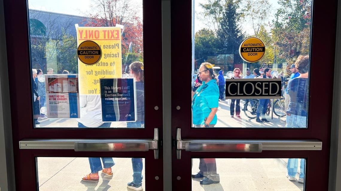 Early voting lines wrapped around the Eastside Branch Public Library in Lexington, KY, causing voting poll workers to loop citizens around the rear of the building as early as 7:30 a.m. on October 31, 2024.
