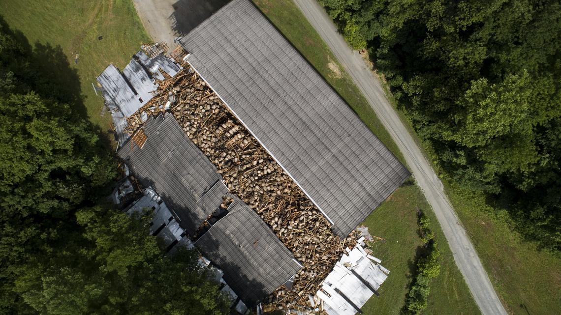 About 9,000 barrels of bourbon sat in piles of debris after a section of a barrel storage warehouse collapsed Friday at the Barton 1792 Distillery in Bardstown.