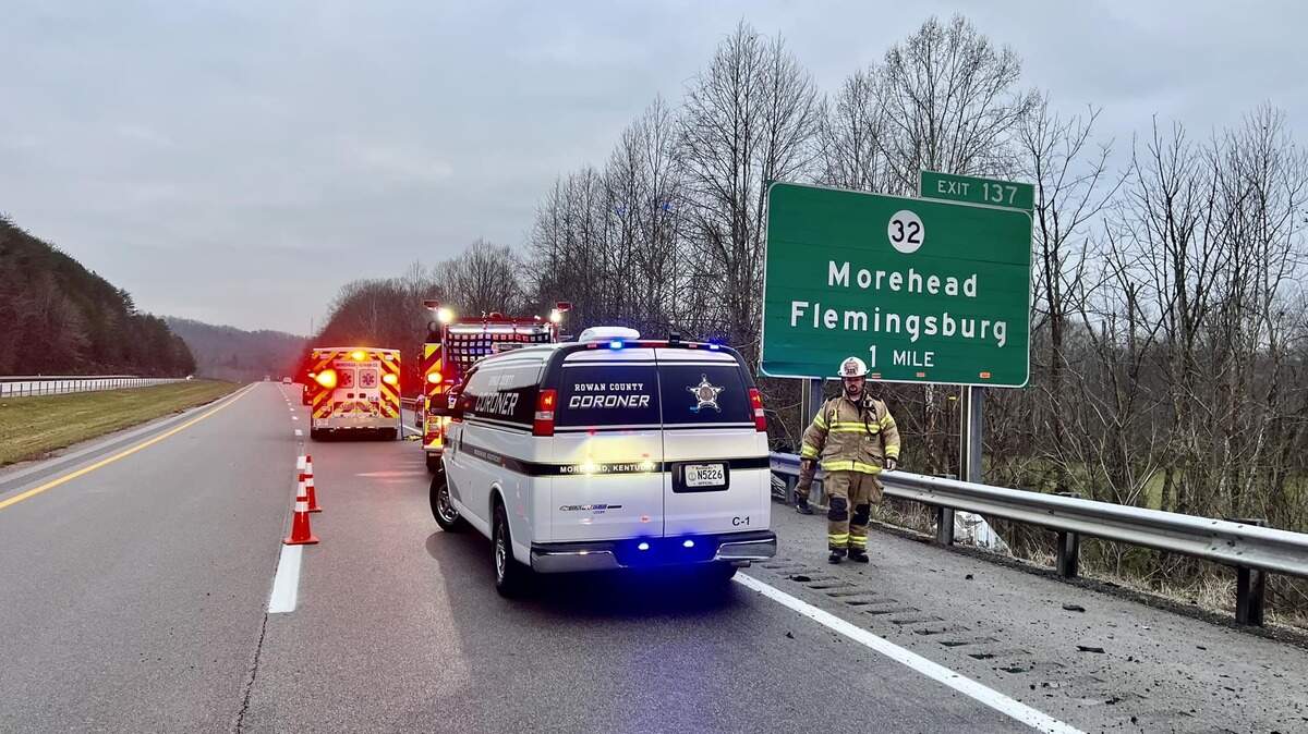 The Rowan County coroner’s van at the scene of the fatal single-vehicle accident on I-64 west of Morehead on Wednesday.