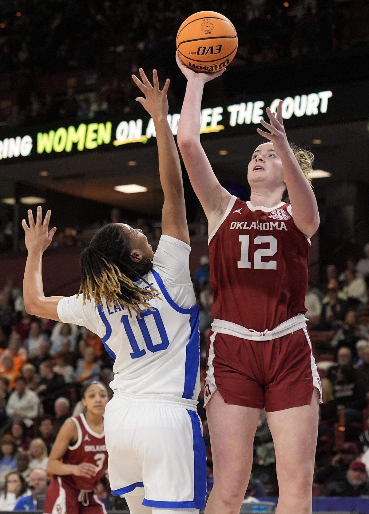 Payton Verhulst (12) shoots over Kentucky’s Dazia Lawrence (10) during the first half Friday. Verhulst scored 16 points for the Sooners.