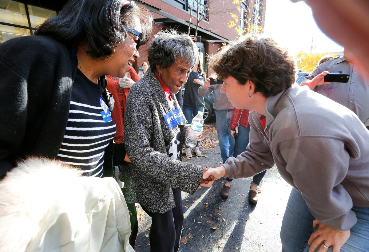 Sixth Congressional District Democratic candidate Amy McGrath, right, talked with 95-year-old Iva Williams, middle, and Williams’ daughter Jacci Jackson, left, as McGrath met with supporters Monday afternoon at her Fayette County Canvass Launch held at 333 East Main Street in Lexington. McGrath is running against Republican incumbent Andy Barr.