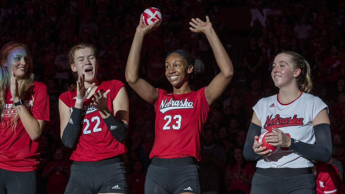Nebraska middle blocker Kaitlyn Hord waves to the crowd before the program’s Red-White Scrimmage this season.