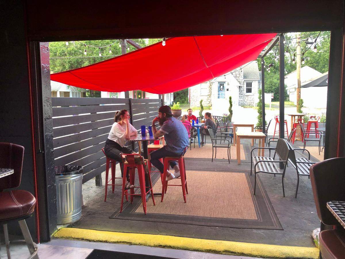The view of the patio through the front garage door at Rosemont Station.