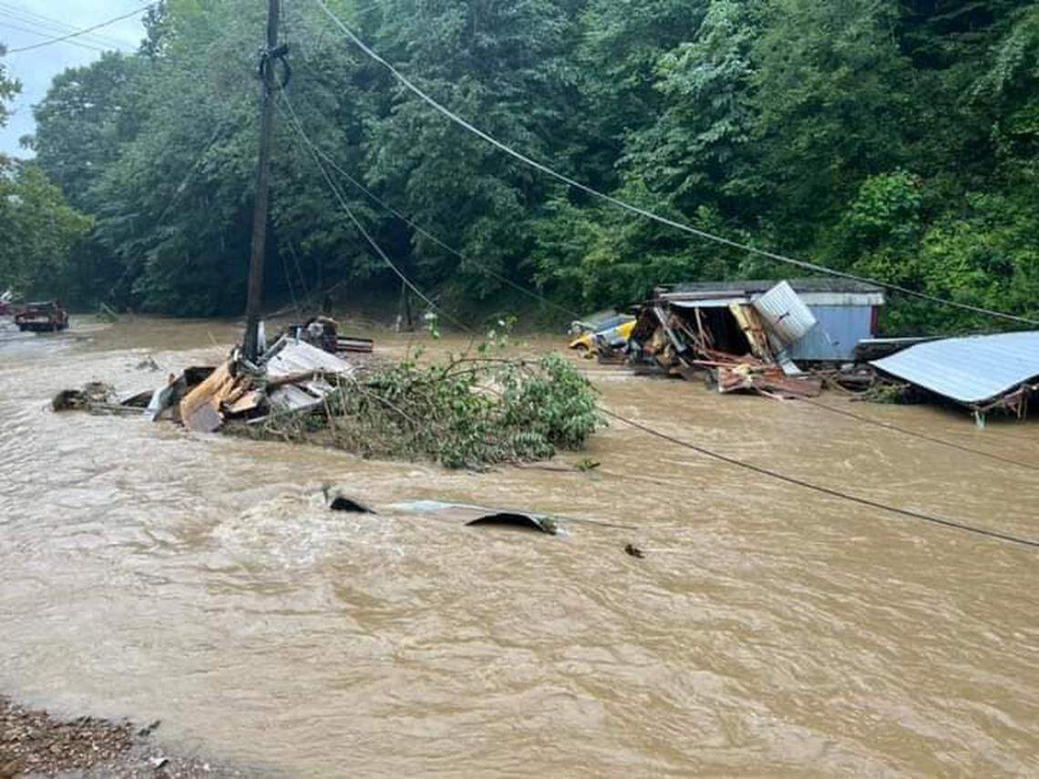 A photo of Bobbie Noble and her family’s former home, overtaken by a flooded Caney Creek