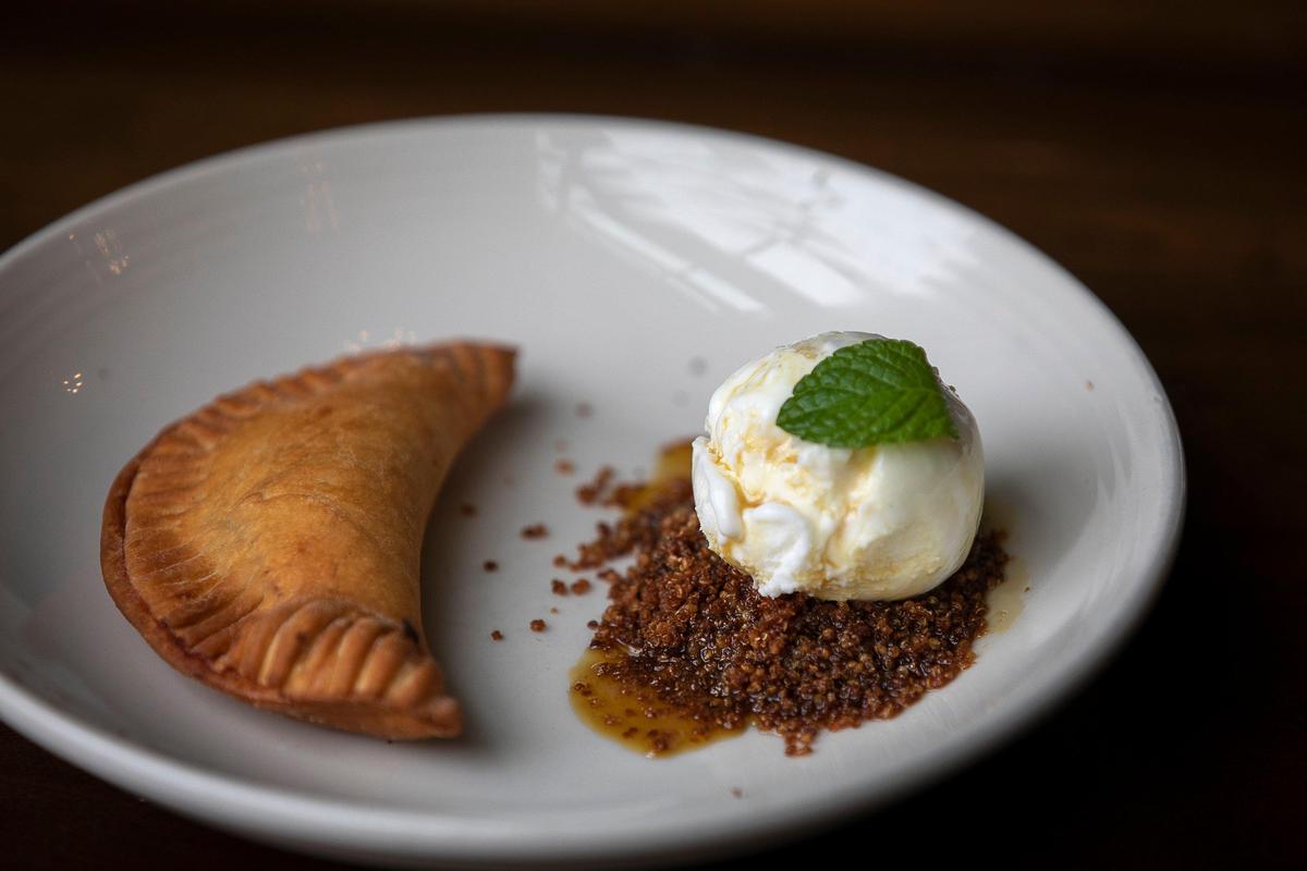 Honeywood is serving a sorghum syrup-drizzled dessert of vanilla gelato atop granola toasted quinoa with an apple hand pie at Honeywood in Lexington, Ky., Thursday, Jan. 2, 2020.