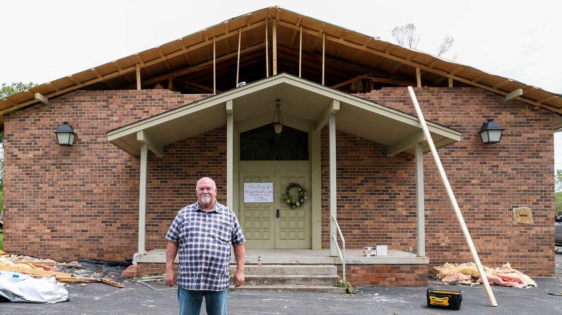 Slate Hill Baptist Church pastor Robert Williams stand in front of his church on Barbourville Road, Sunday, May 18, 2025, just outside of London, Ky. in Laurel County. Two days earlier, thunderstorms and a deadly tornado ripped through the Southern Kentucky city destroying many homes.