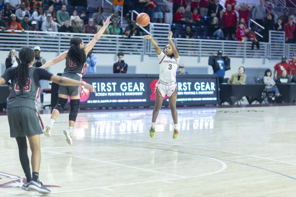 Frederick Douglass' Eiona Atkins (3) shoots the ball to give Douglass the lead in a game against Paul Laurence Dunbar during the Girls 11th Region Tournament championship game at Eastern Kentucky University's Baptist Health Arena in Richmond, Ky., on Sunday, March 8, 2026.