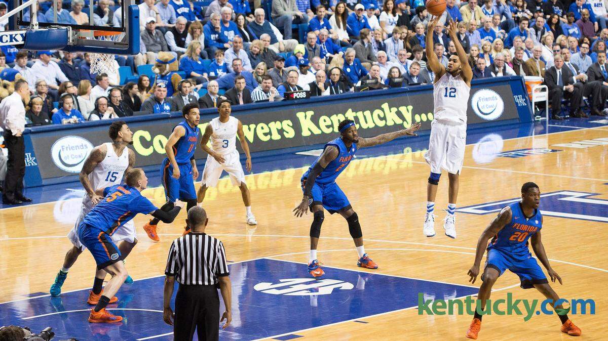 Kentucky Wildcats forward Karl-Anthony Towns (12) puts up a shot  over Florida during the first half of their last regular season  game in Lexington, Ky., on Saturday, March 7, 2015. Kentucky  defeated Florida 67-50 to win their 31st game and finish the  regular season undefeated. Photo by David Stephenson