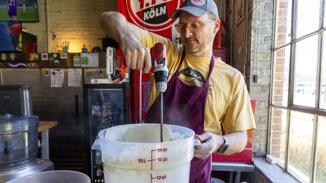 The Wandering Bock Pretzel Pub & Brat Haus co-owner Jeremy Markle feeds his sourdough starter. “The first day is basically feeding your sourdough starter so that it's ready to go the next day,” said Markle. “And then you do mixing and forming and cold proofing on the second day. And then on the third day, you can do (lye) dipping and baking. So, it's three-day process.”