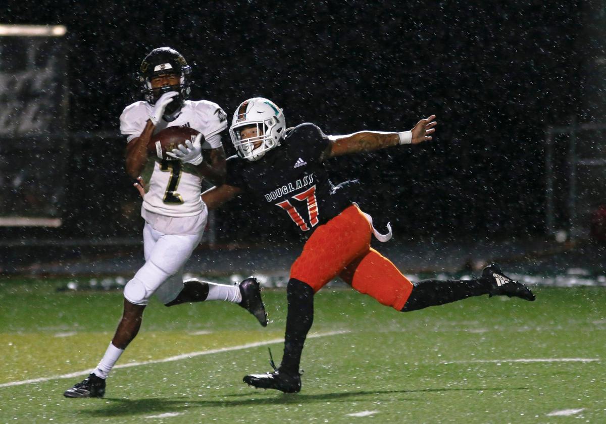 Boyle County’s Sage Dawson (2) intercepted a pass intended for Jakari Cowherd (17) during the first quarter Friday night at Frederick Douglass.