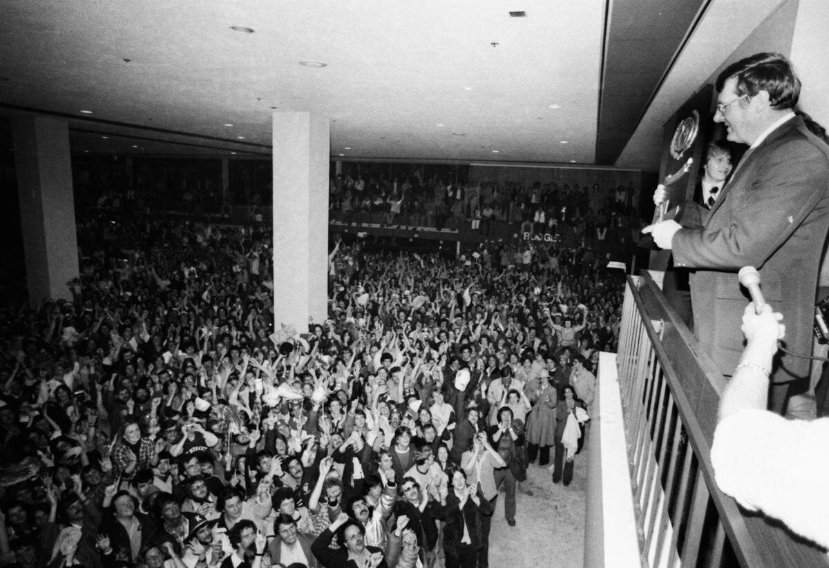 Coach Joe B. Hall looked out over the mob of 7,000 that greeted the returning Wildcats at Blue Grass Field after their NCAA championship win in St. Louis on March 28, 1978.