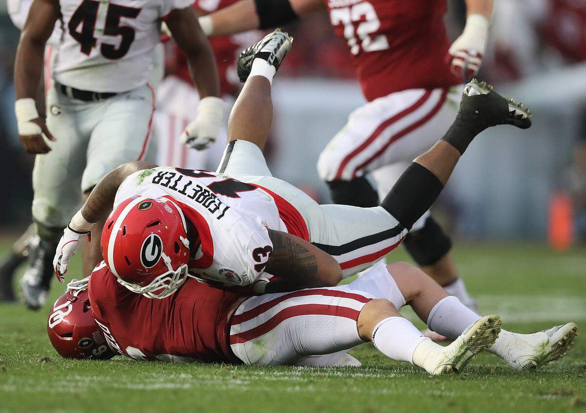 Georgia senior defensive end Jonathan Ledbetter (atop pile) has 28 tackles and one tackle for loss so far in 2018.