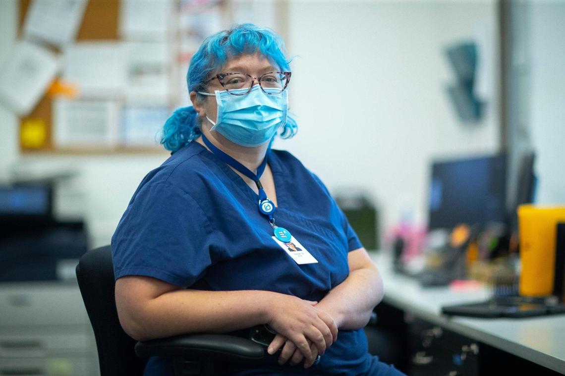 Stevie Benge, a Planned Parenthood medical receptionist, poses for a portrait in Louisville, Ky., on Thursday, June 16, 2022.