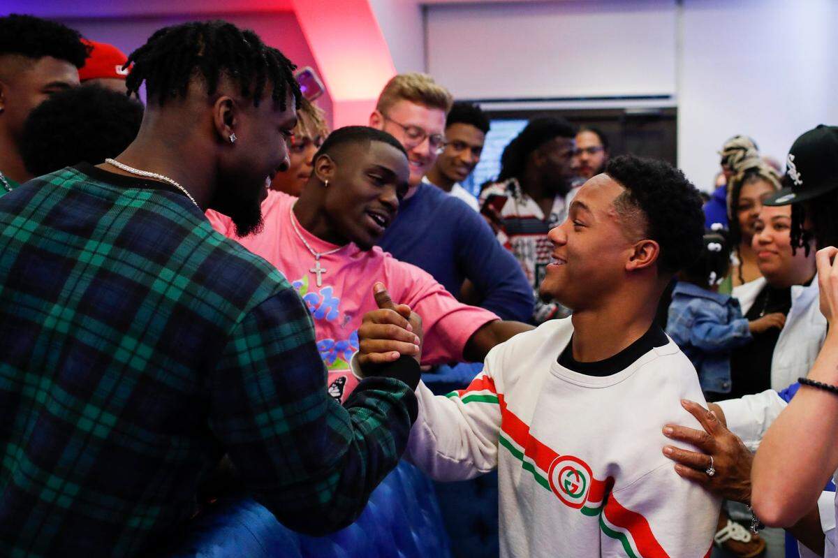 Former UK star wide receiver Wan’Dale Robinson celebrates becoming the 43rd pick of the 2022 NFL Draft during a watch party at the Griffin Gate Marriott in Lexington on Friday night.