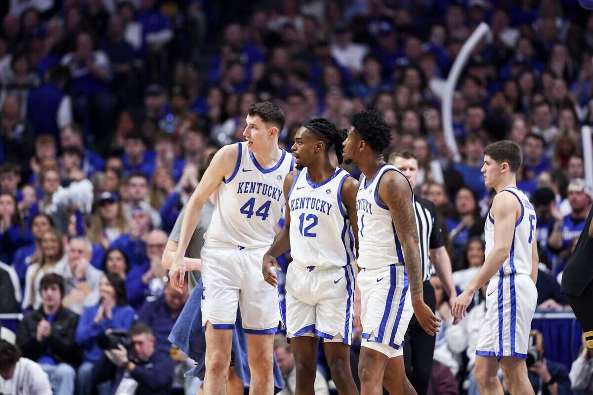 Kentucky’s Antonio Reeves (12) talks with his teammates during Wednesday’s game against Vanderbilt at Rupp Arena. Reeves scored 20 points on Senior Night.