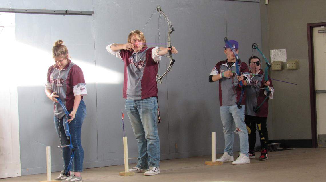 Members of the archery team at the David School in Floyd County, Kentucky practiced after school on Dec. 6, 2024. From left to right, they are Breonna Mullett, Cody Curtis, Brett Spears II and Jessica Bradley.