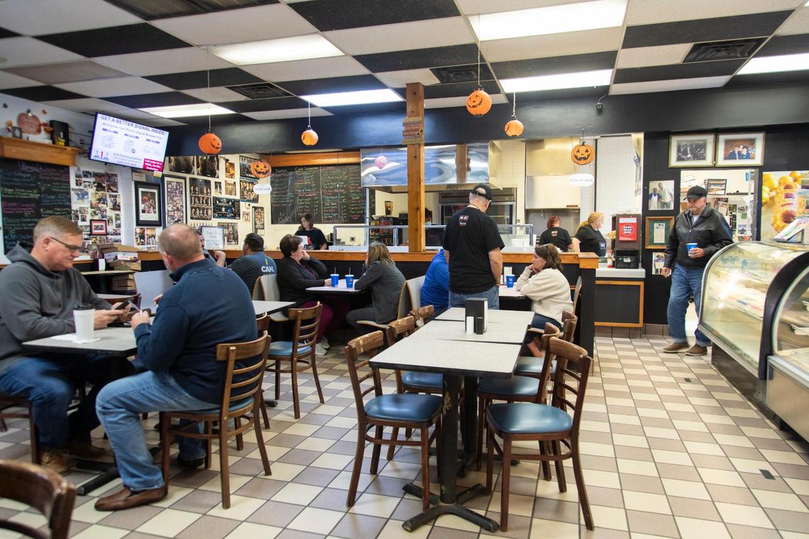 Second generation owner Doug Stephens talks with customers at Amon’s Sugar Shack in Somerset, Ky., Wednesday, November 3, 2021. Stephens inherited the business from his parents Amon and Rosemary in the late 1990s.