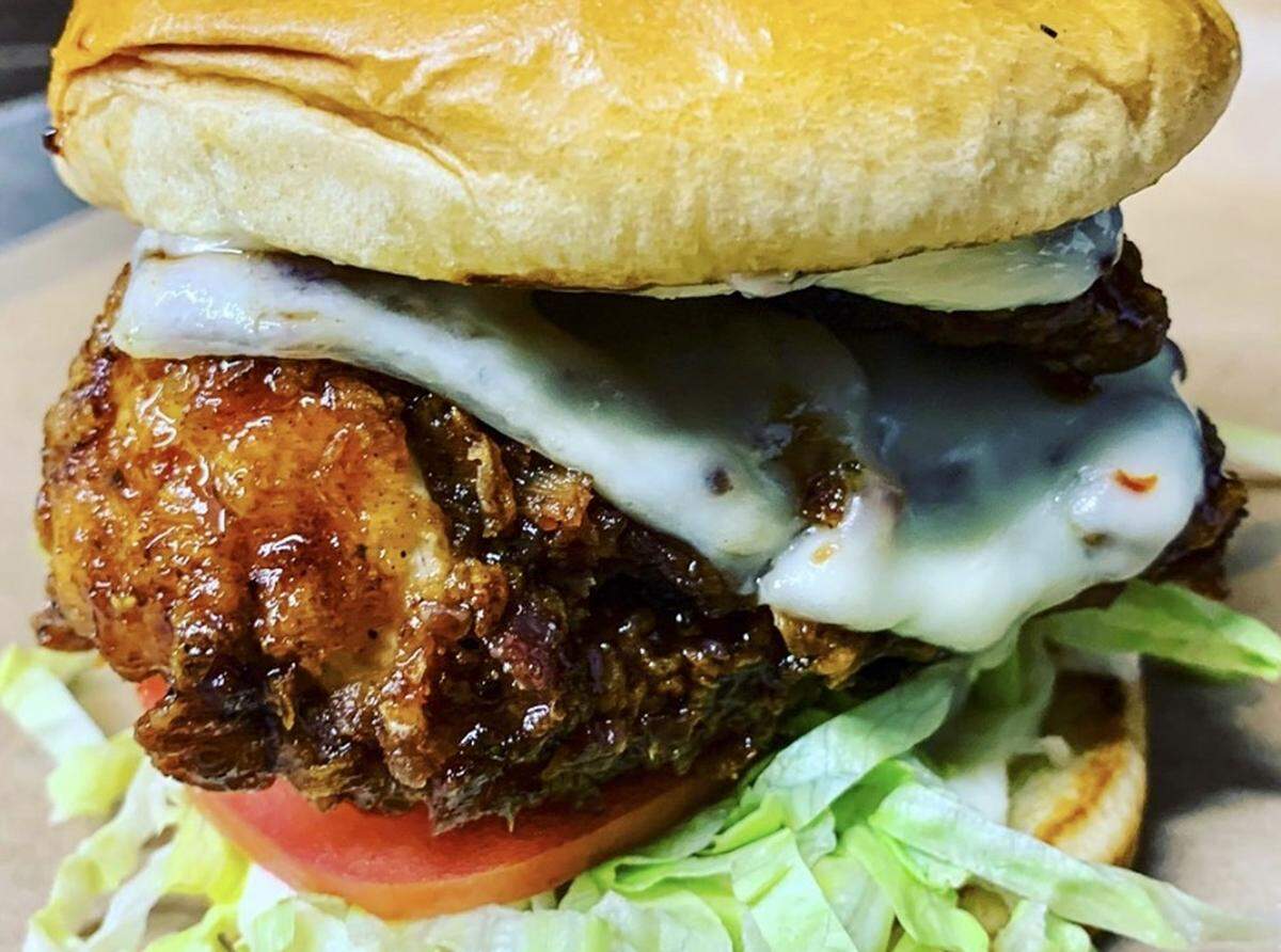 The orange honey butter and red chili-dipped fried chicken sandwich from Azur.