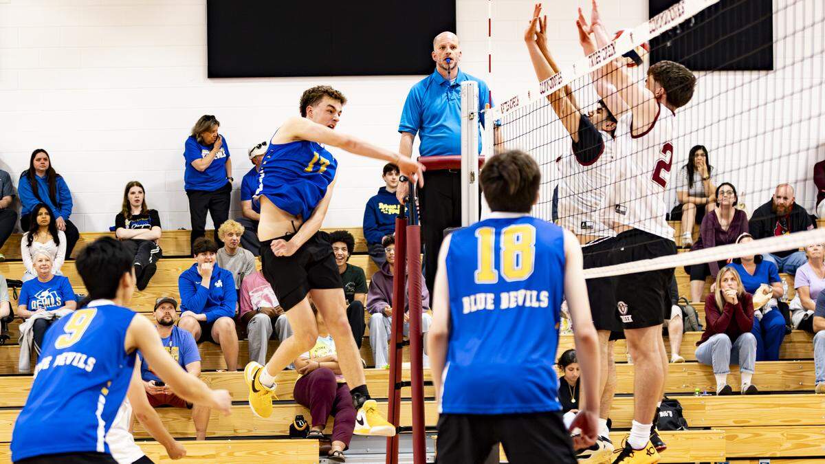 Henry Clay outside hitter Gray Millar (17) delivers a kill during the Blue Devils 3-0 win at Tates Creek High School on Wednesday.
