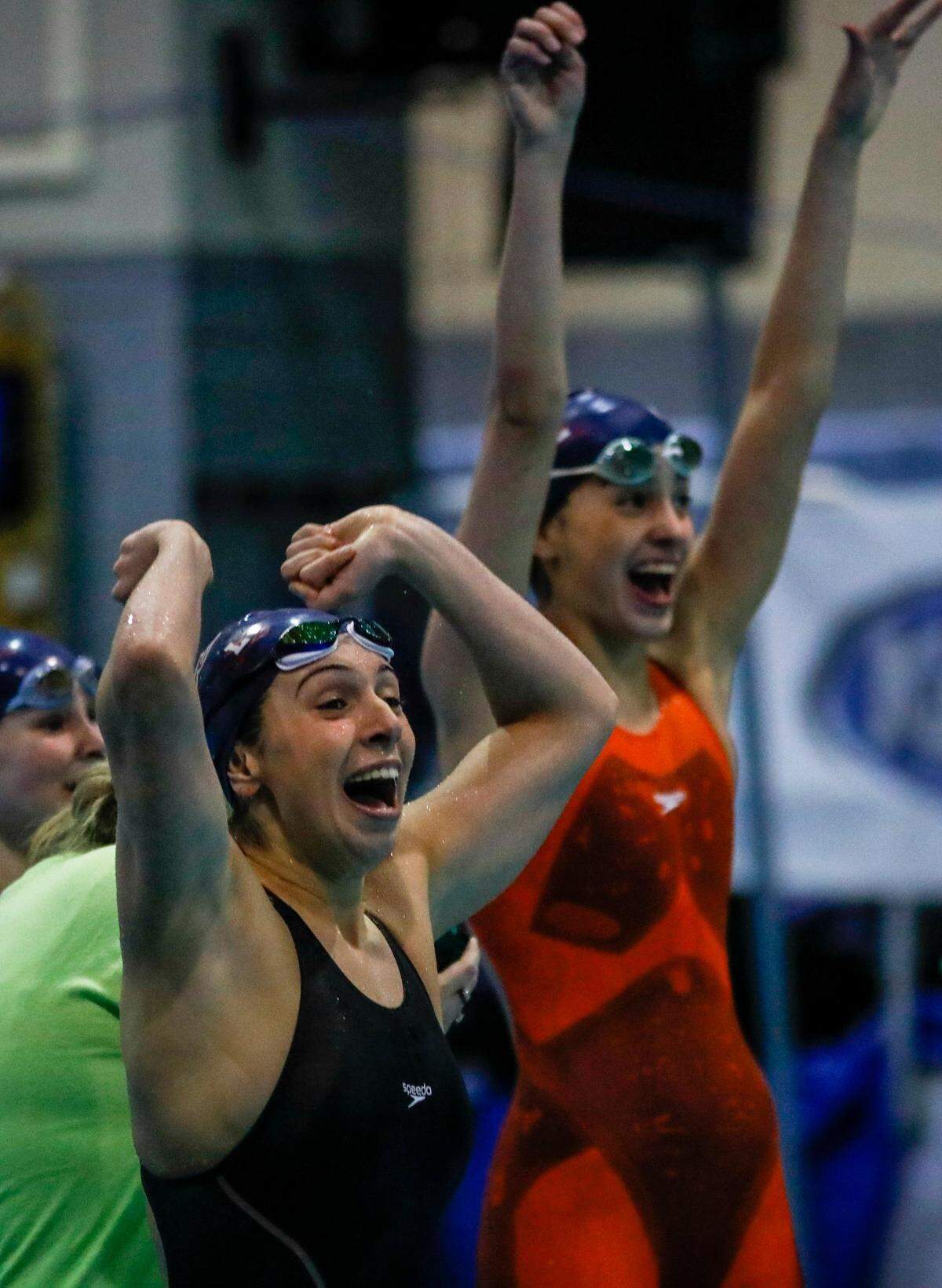 Lafayette’s Lili Elayi, left, and Lou Elayi, celebrate the team’s win the girls’ 200-yard medley relay during the state championships at UK’s Lancaster Aquatic Center.
