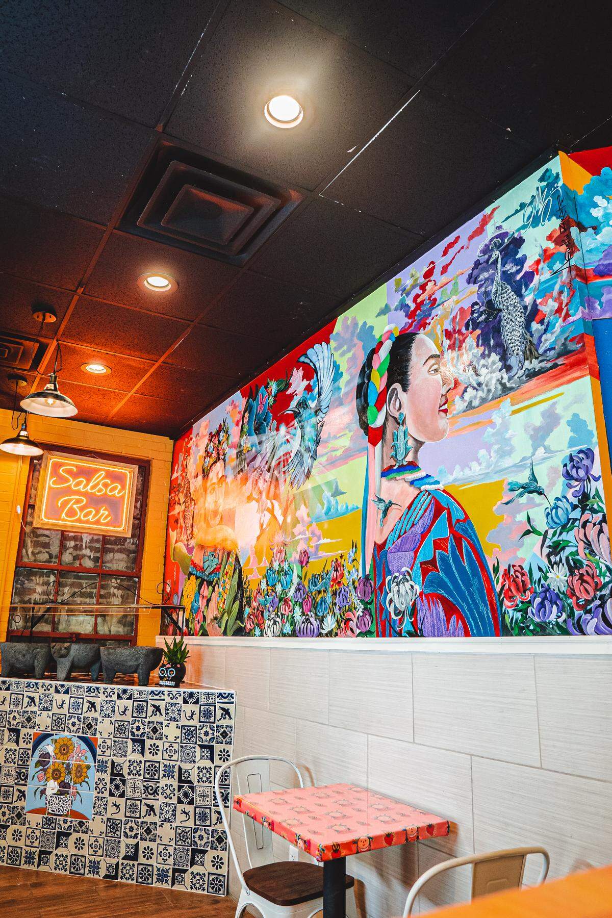 The interior of La Taquiza now includes murals of Mexican icons as well as imported tile. The salsa bar features authentic house-made salsas daily.