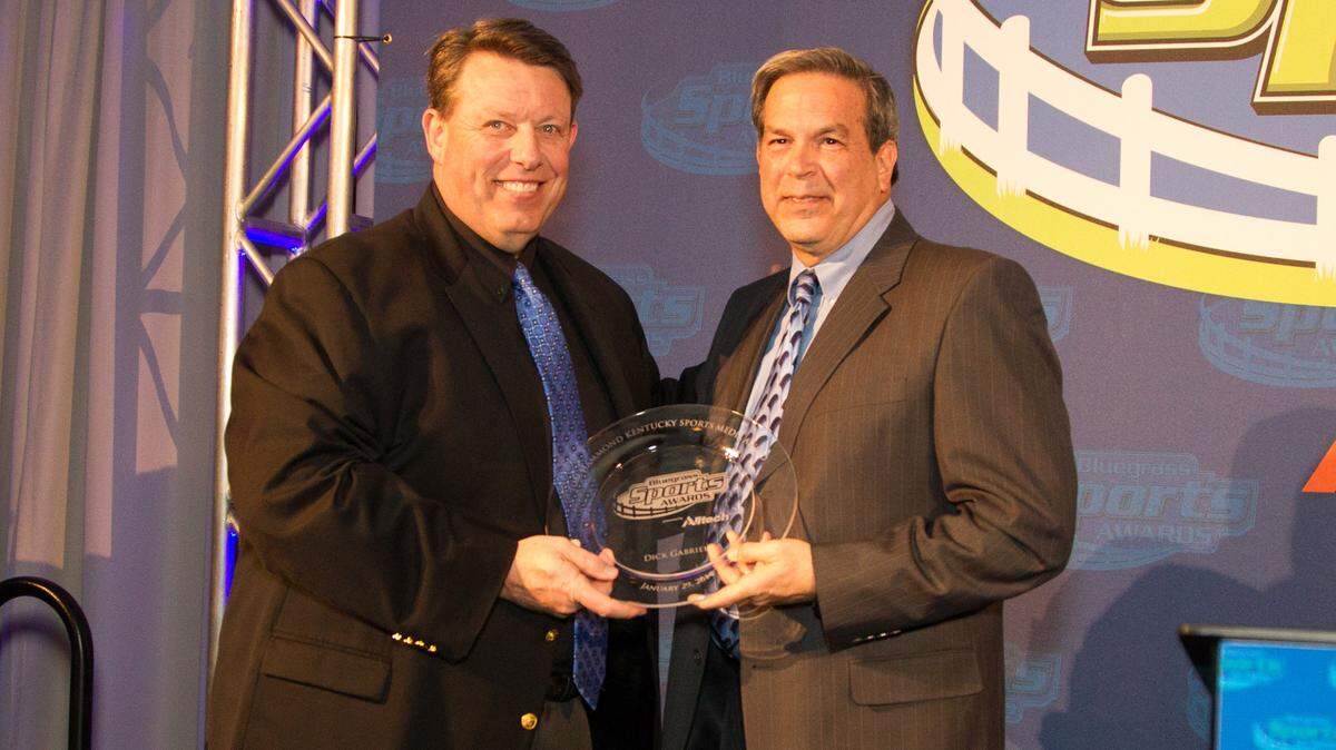 Tom Leach, left, presented Dick Gabriel the Tom Hammond Kentucky Sports Media Award during the Bluegrass Sports Awards  banquet in Lexington in 2014.