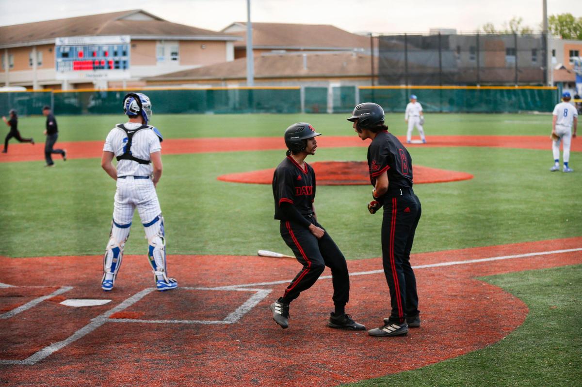 Jayden Tyree (12) celebrates scoring for Paul Laurence Dunbar during its 8-2 win at Lexington Catholic on Tuesday night. One day later, the Knights beat the Bulldogs 11-7.