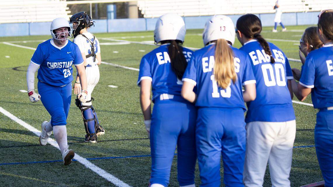 Lexington Christian’s Madison Wertzler celebrates as she approaches her teammates at home plate following her two-run home run in the sixth inning of the Eagles’ 7-5 win at Lexington Catholic on Thursday.