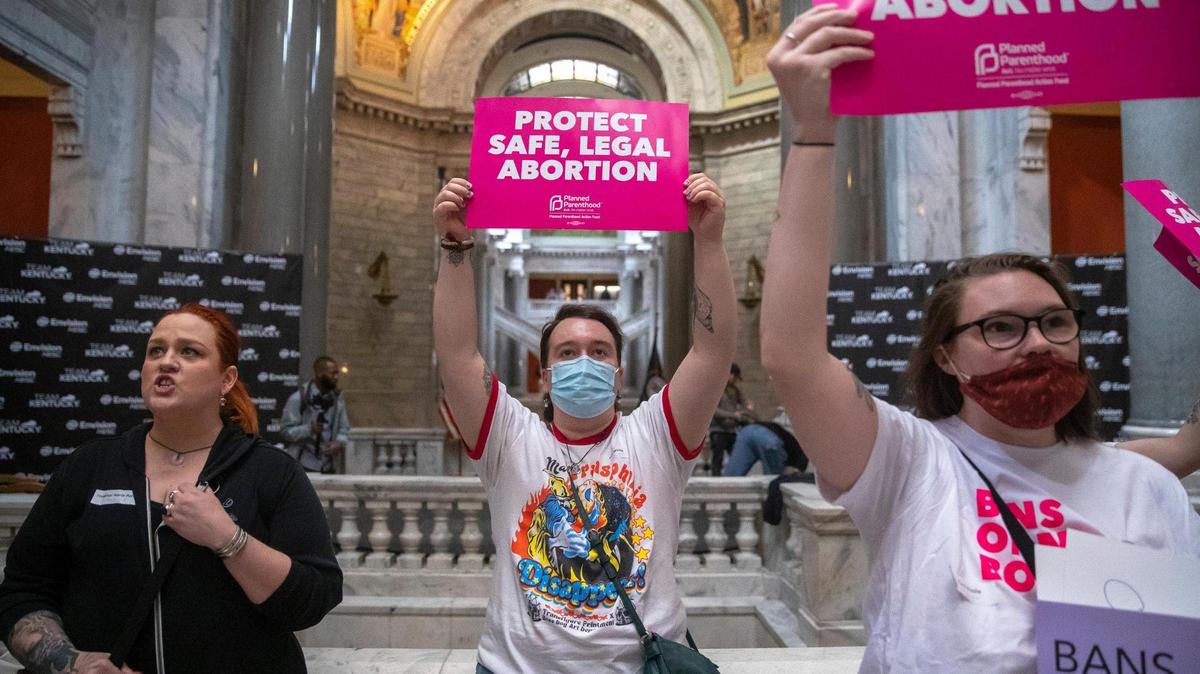 Jace Peters-White of Lexington, center, joined others protesting at the Kentucky state Capitol in Frankfort, Ky., on Wednesday, April 13, 2022. Protesters chanted “Bans off our bodies” as they anticipated Kentucky Gov. Andy Beshear’s veto of a sweepingly restrictive abortion bill, HB3, would be overridden.