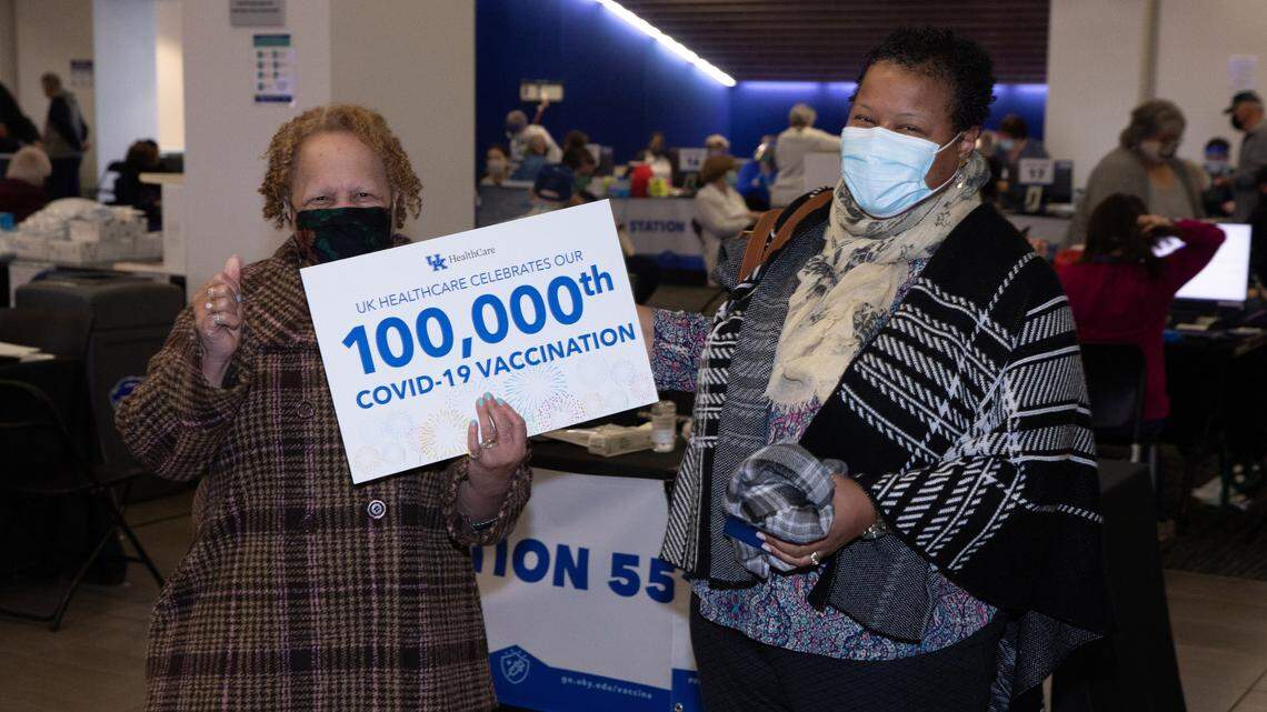 Roberta Mason, left, of Frankfort, with her daughter Sherry Brown, received the 100,000th COVID-19 vaccination at Kroger Field on the University of Kentucky campus Thursday. University of Kentucky volunteers and staff began vaccinating local residents against the coronavirus on Jan. 19 inside the home of the football Wildcats that has become the university’s centralized vaccine distribution center. Many who have received the vaccine there have praised the university’s process as easy and efficient.