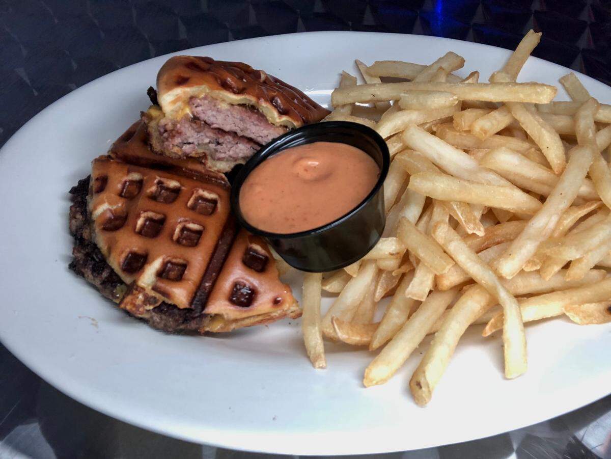 The Willy’s Waffle Burger and fries at Rosemont Station in Lexington.