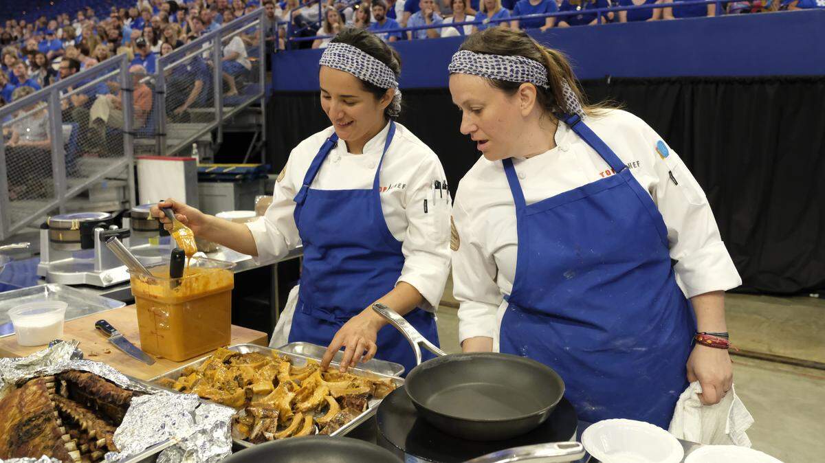 Cooking courtside, Michelle Minori and Sara Bradley of the Blue team know the sting of defeat.