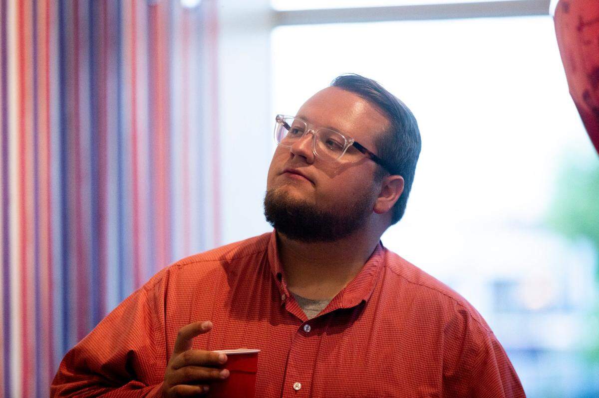 Andrew Cooperrider watches election night results at his watch party at Brewed in Lexington, Ky., on Tuesday, May 17, 2022.