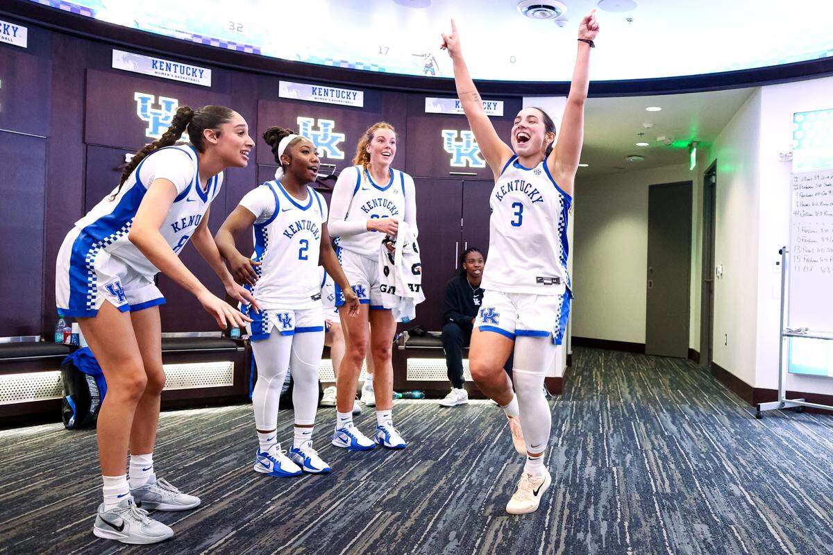 Kentucky’s Georgia Amoore (3) and her teammates celebrate after their defeat of Louisville in November. Amoore has expressed to UK head coach Kenny Brooks that she would like to become a coach when her playing career is over, and she leads the Wildcats like a coach in training.