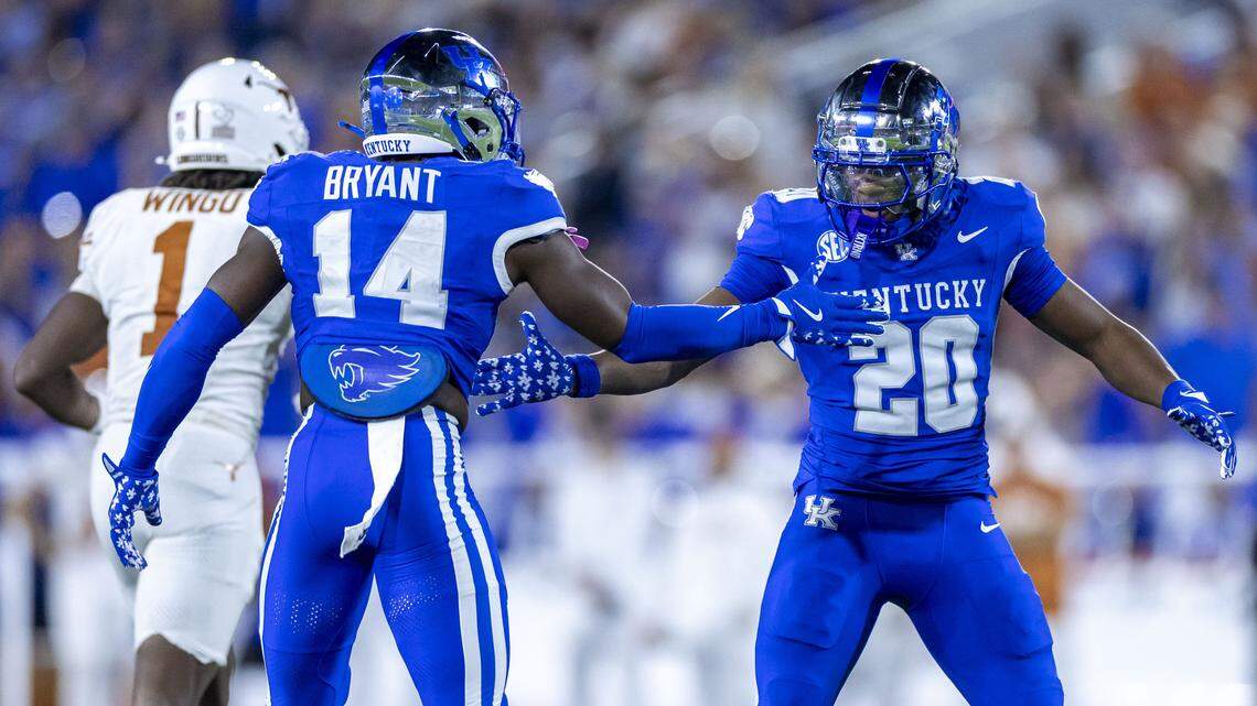 Kentucky cornerback Terhyon Nichols (20) and safety Ty Bryant celebrated a defensive stop during UK’s 16-13 overtime loss to Texas last Saturday.