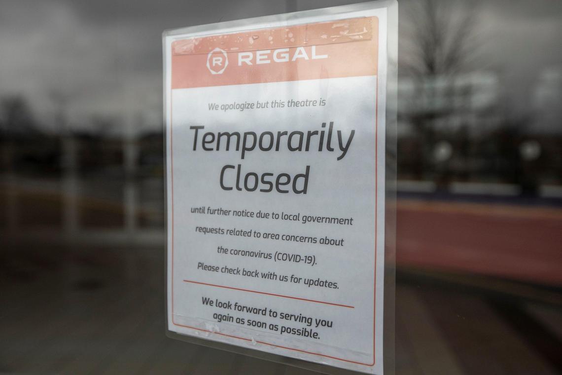 Signs on the doors of Regal Cinemas at Hamburg Pavilion state the theater is temporarily closed due to local government request related to concerns about the coronavirus.