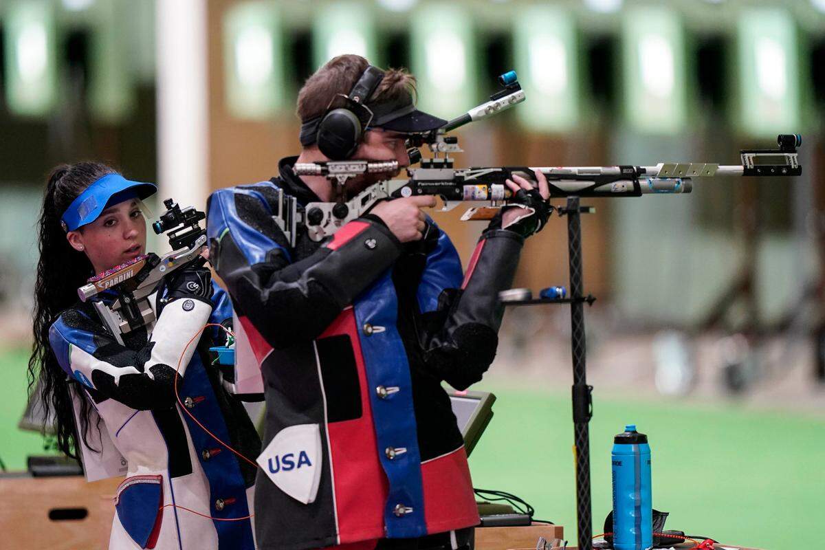 Mary Tucker, left, and Lucas Kozeniesky competed for the United States in the mixed team 10-meter air rifle event at the Asaka Shooting Range in the Summer Olympics on Tuesday in Tokyo.